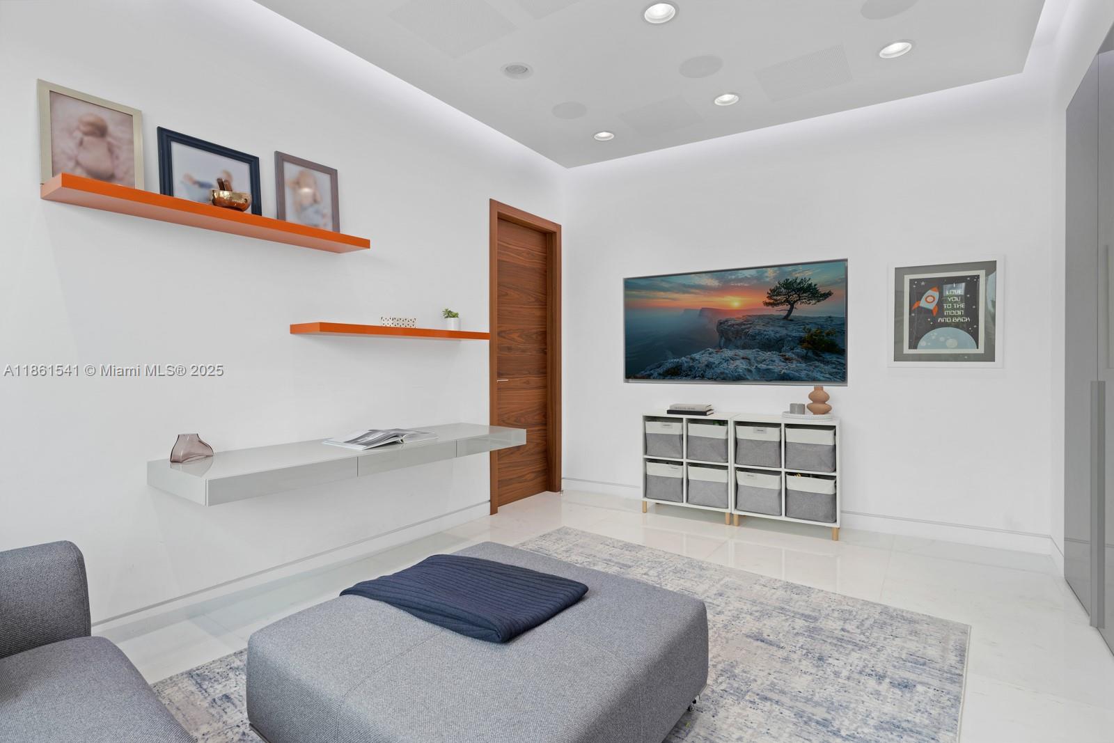 1825 Cleveland Road Miami Beach, FL 33141 - Photo 21 of 35 a living room with furniture and a flat screen tv