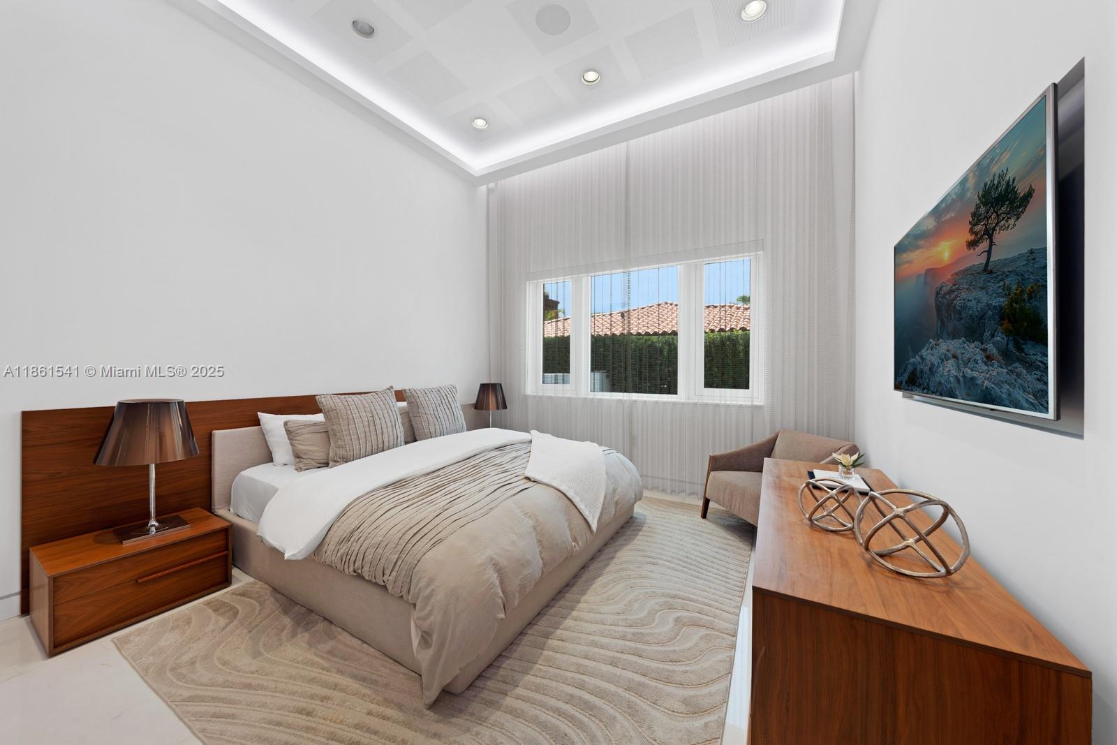 1825 Cleveland Road Miami Beach, FL 33141 - Photo 24 of 35 a bedroom with a bed and wooden floor