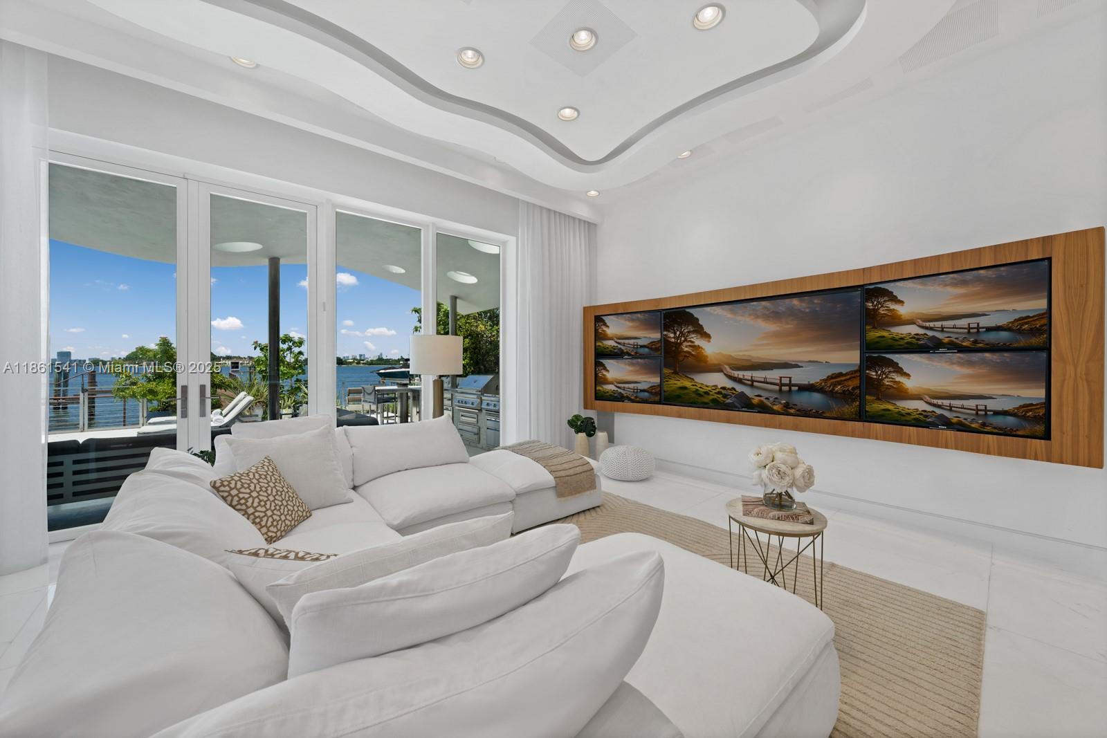 1825 Cleveland Road Miami Beach, FL 33141 - Photo 6 of 35 a living room with furniture and a flat screen tv