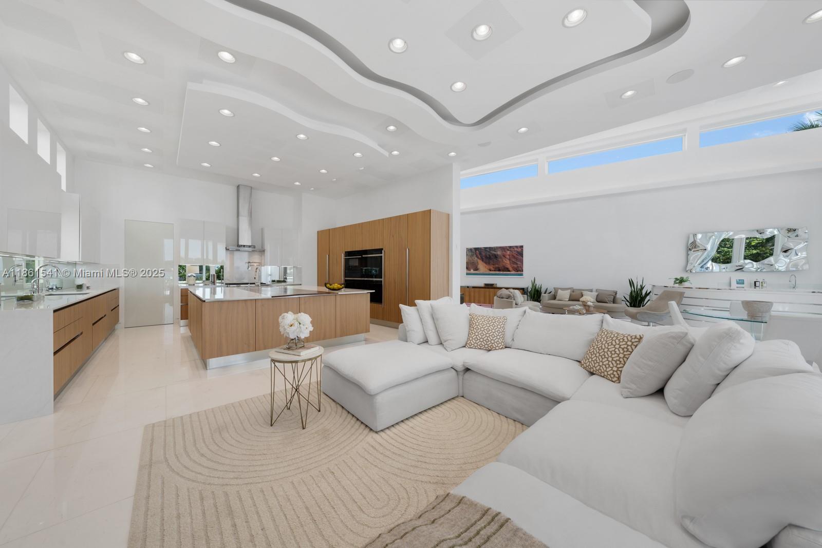 1825 Cleveland Road Miami Beach, FL 33141 - Photo 7 of 35 a living room with furniture and view of kitchen