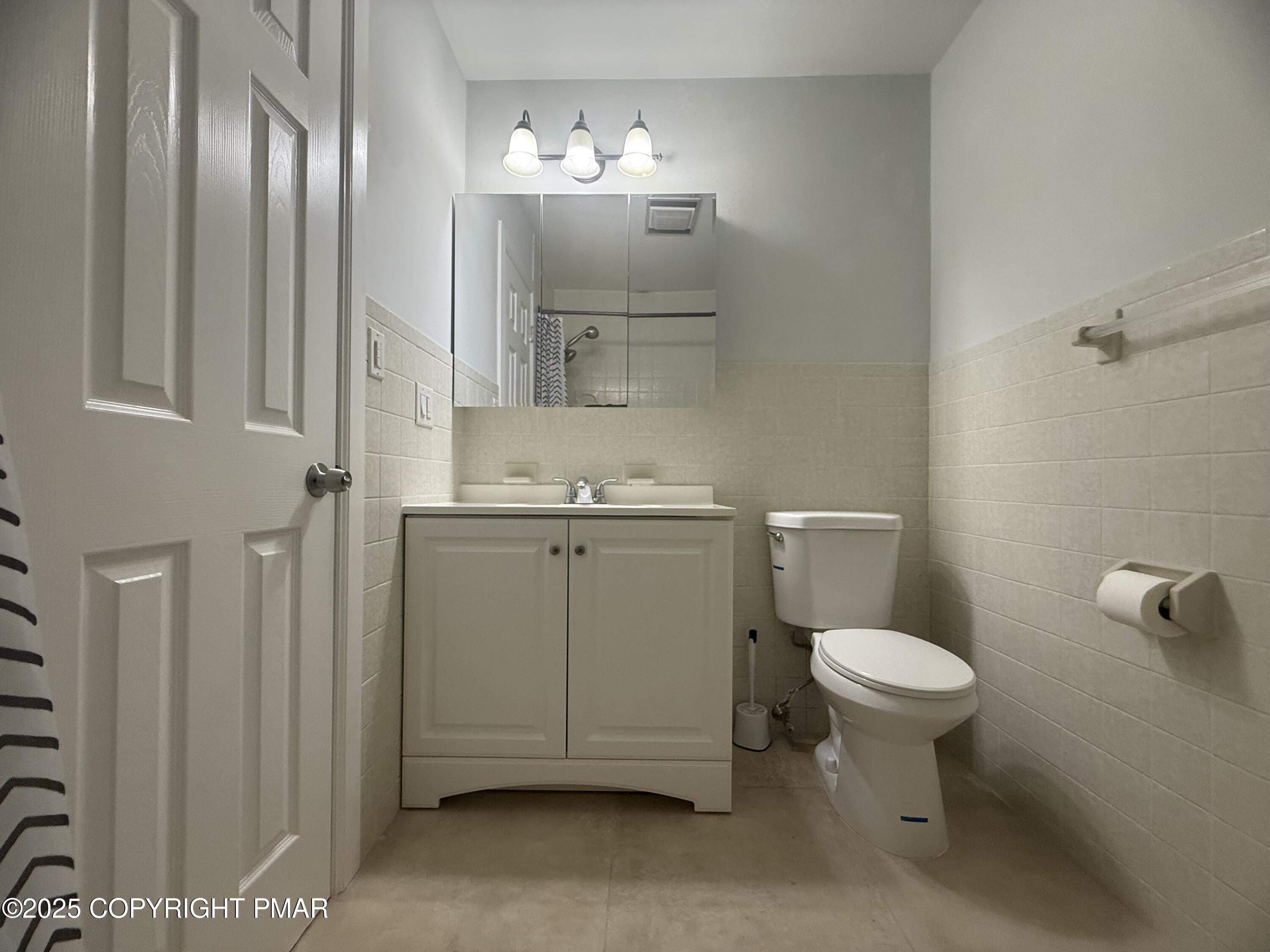 37 Seneca Road Mount Pocono, PA 18344 - Photo 27 of 46 a bathroom with a toilet sink and mirror