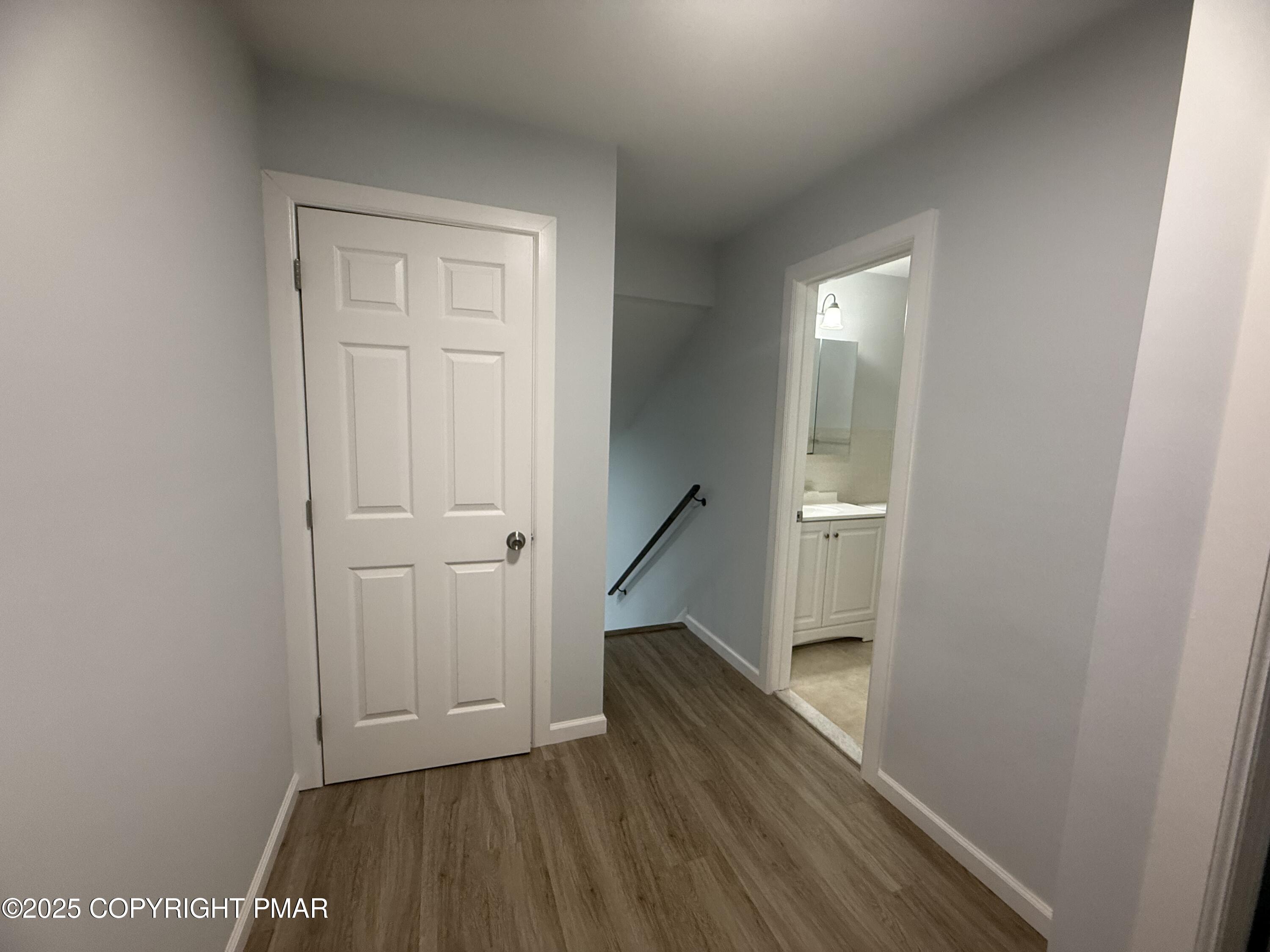 37 Seneca Road Mount Pocono, PA 18344 - Photo 28 of 46 a view of a hallway with wooden floor and staircase