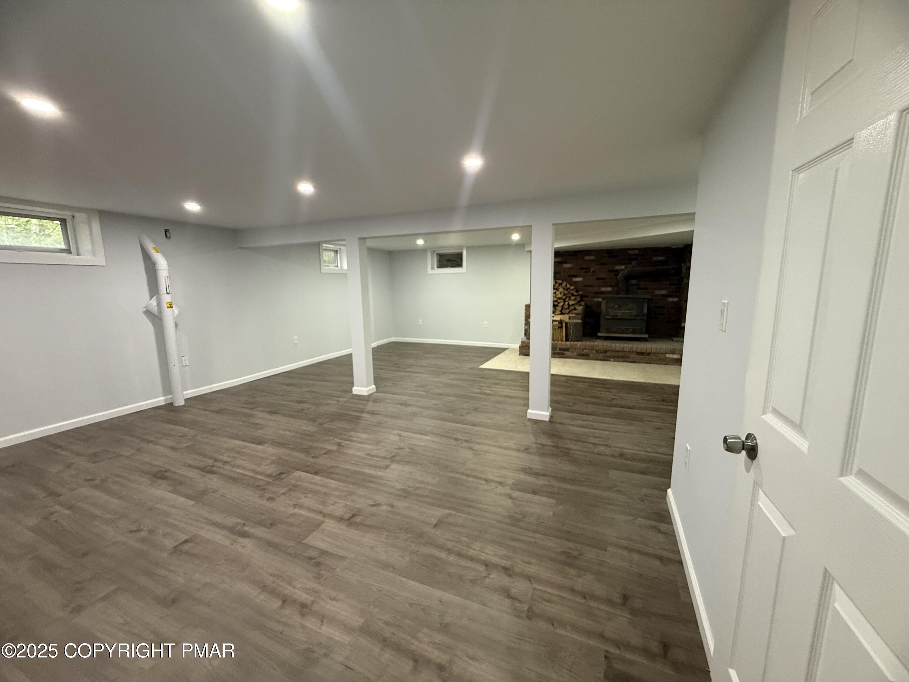 37 Seneca Road Mount Pocono, PA 18344 - Photo 37 of 46 an empty room with wooden floor and entrance