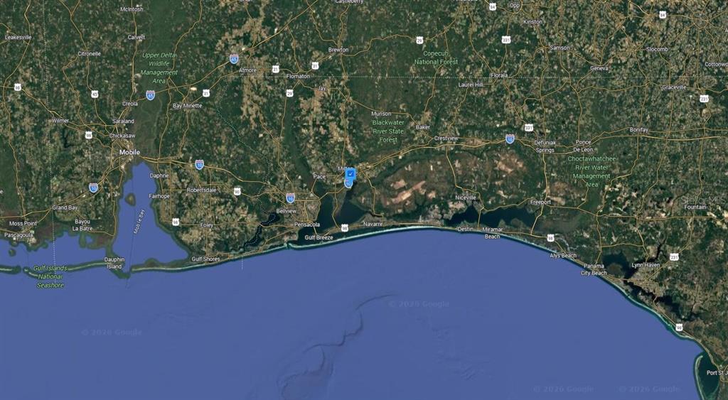 7360 Owensville Road Milton, FL 32583 - Photo 6 of 6 a view of a yard in a backyard