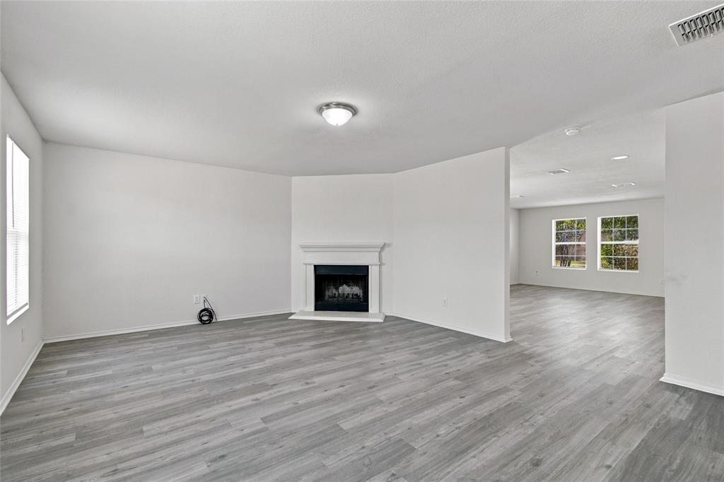 12121 Arbor Lake Road Rhome, TX 76078 - Photo 6 of 33 Large family room that opens into the kitchen