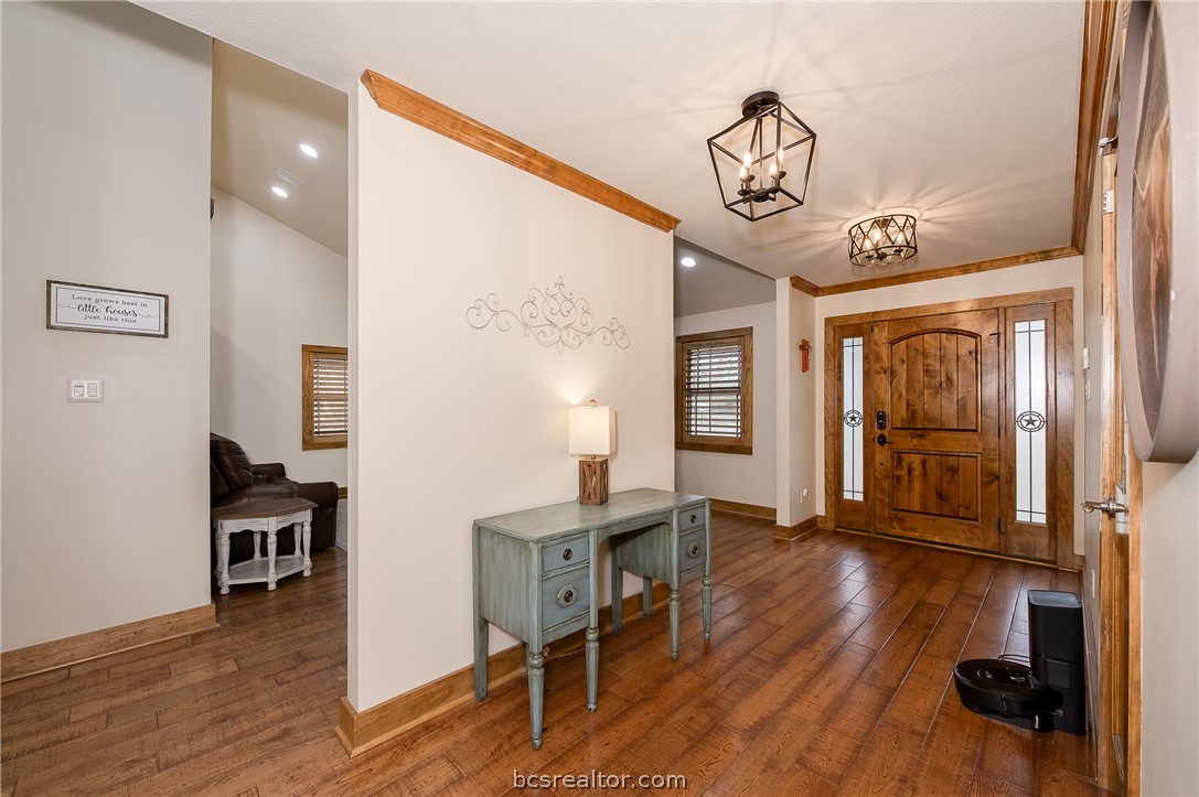 2302 Quail Run College Station, TX 77845 - Photo 7 of 49 a view of hall way with furniture and wooden floor