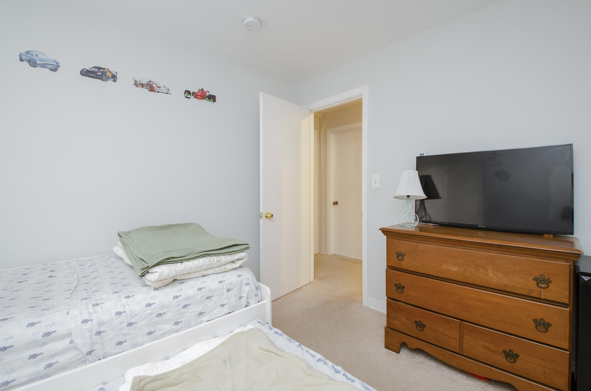 800 Bearses Way, Unit 4EC Hyannis, MA 02601 - Photo 14 of 20 a bedroom with a bed and flat screen tv