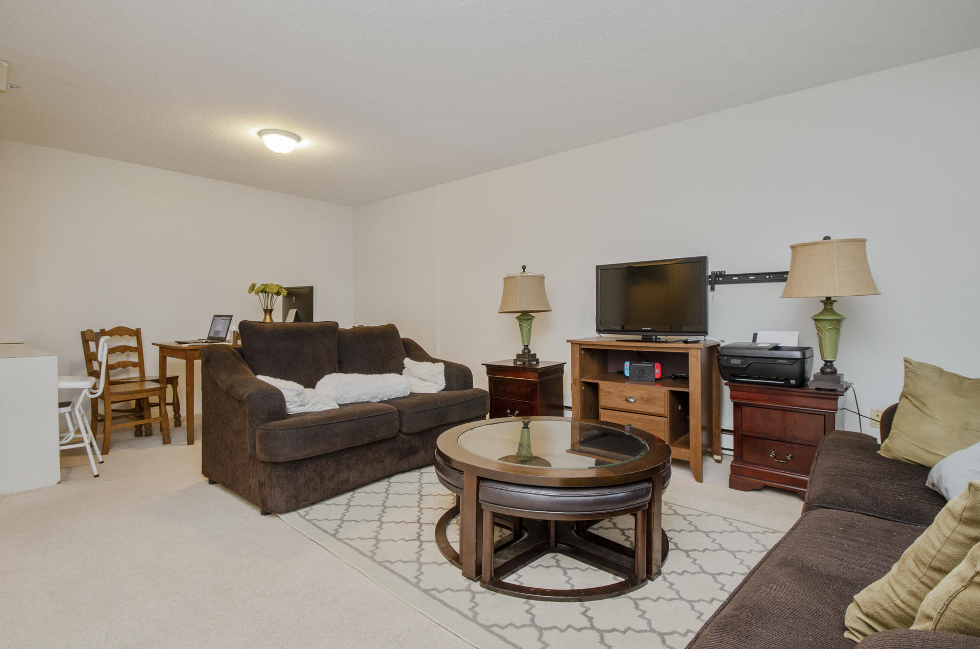 800 Bearses Way, Unit 4EC Hyannis, MA 02601 - Photo 4 of 20 a living room with furniture and a flat screen tv