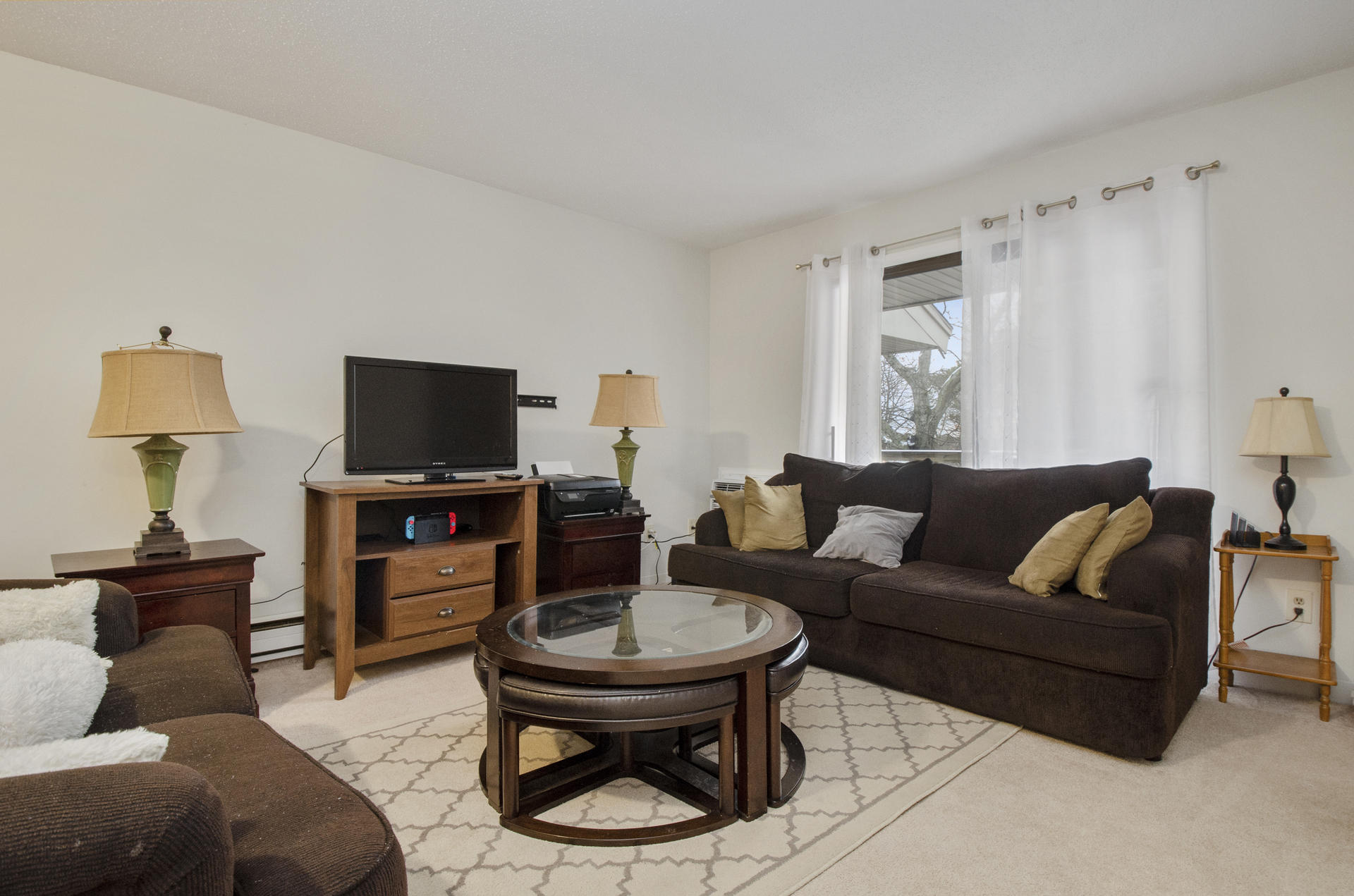 800 Bearses Way, Unit 4EC Hyannis, MA 02601 - Photo 5 of 20 a living room with furniture a flat screen tv and a window