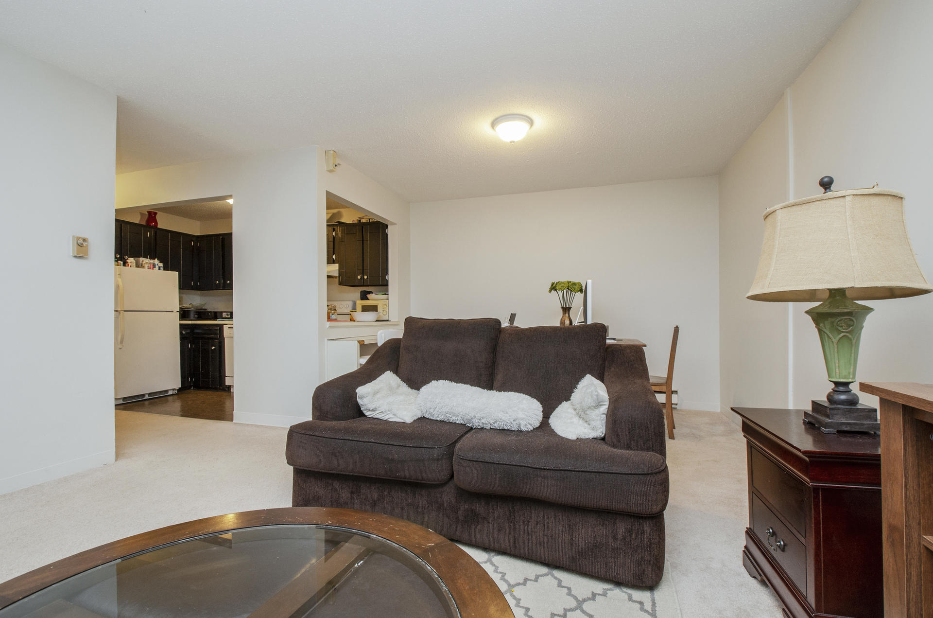 800 Bearses Way, Unit 4EC Hyannis, MA 02601 - Photo 7 of 20 a living room with furniture and a lamp