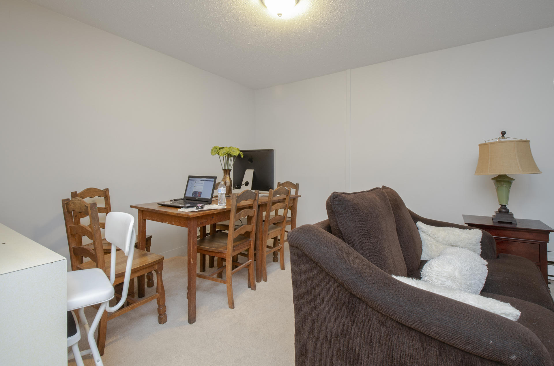 800 Bearses Way, Unit 4EC Hyannis, MA 02601 - Photo 9 of 20 a living room with furniture and a lamp