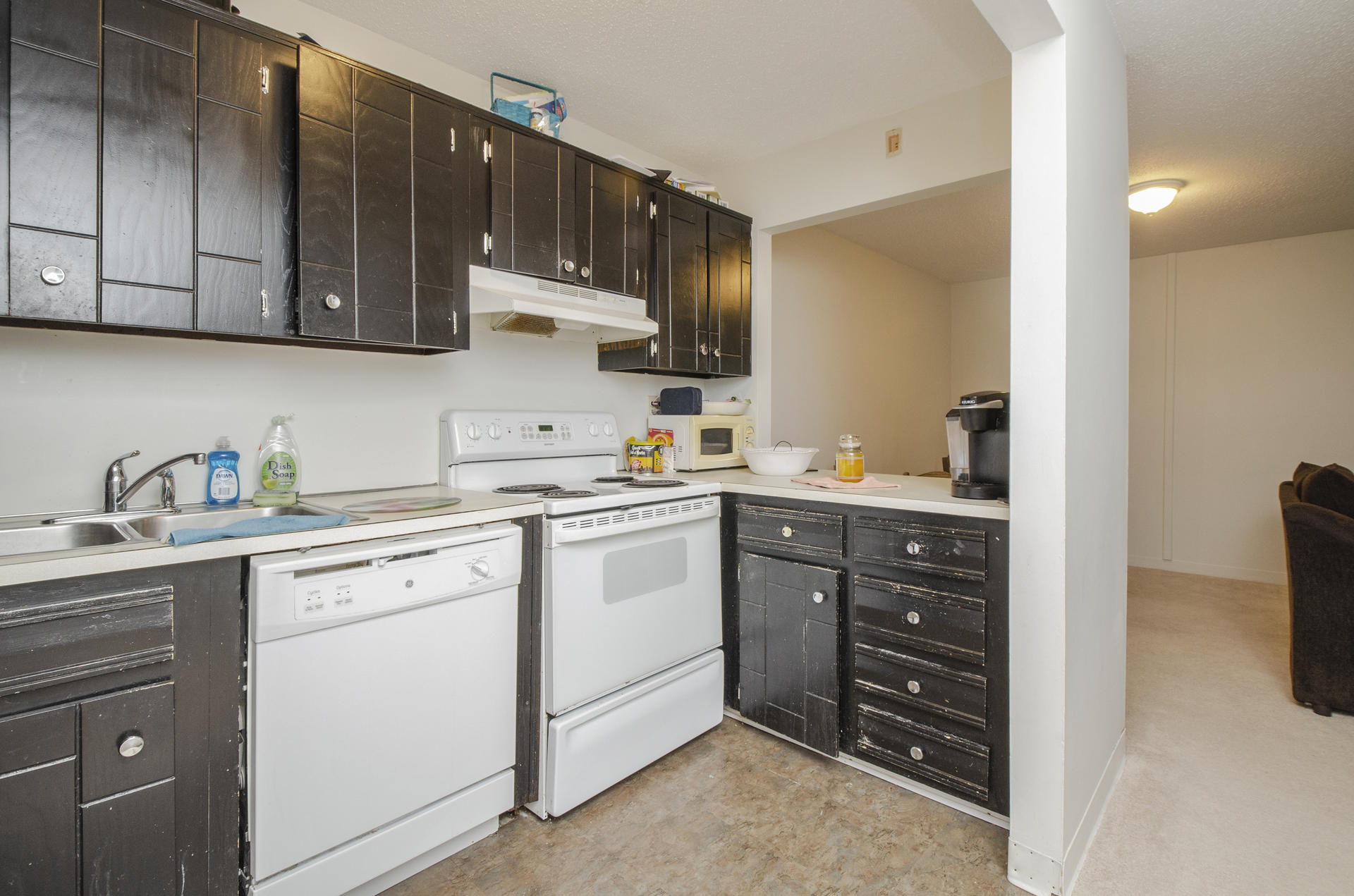 800 Bearses Way, Unit 4EC Hyannis, MA 02601 - Photo 10 of 20 a kitchen with a sink and cabinets