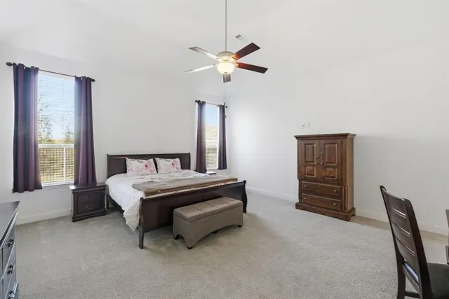 a bed room with a bed and a chandelier