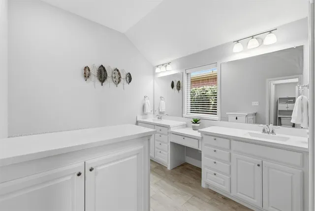 a view with cabinets a sink and dishwasher in a room