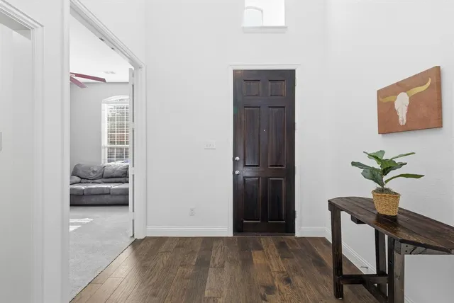 a view of livingroom with furniture and a potted plant