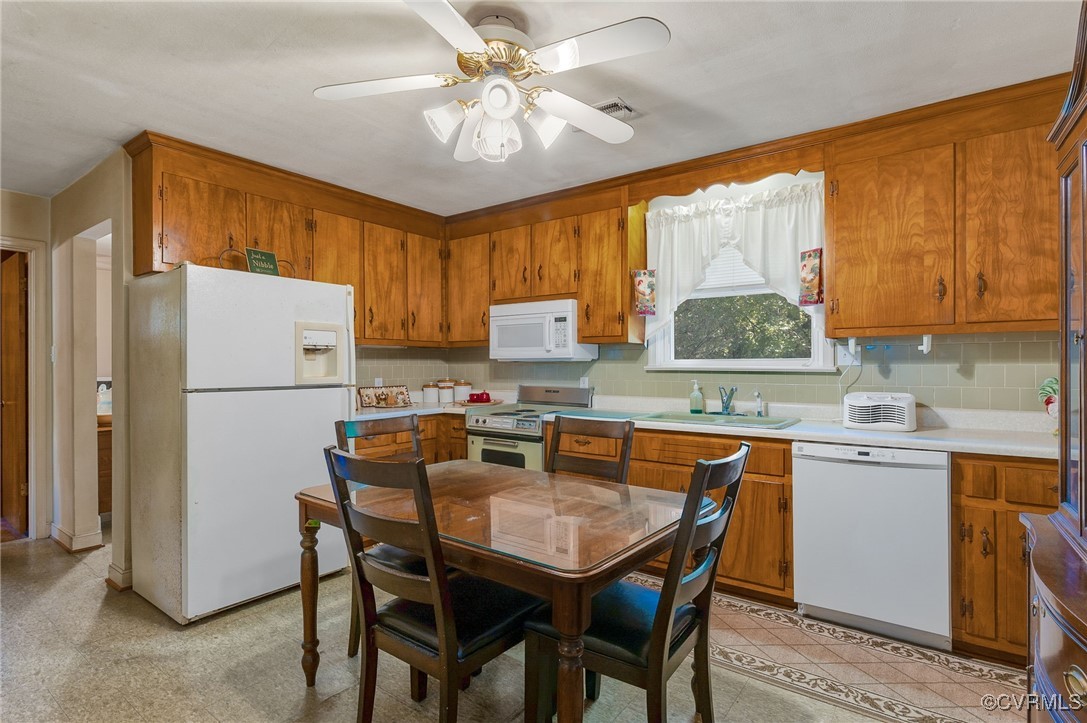 10522 Summer Hill Road Mechanicsville, VA 23116 - Photo 12 of 48 a dining table with chairs and window