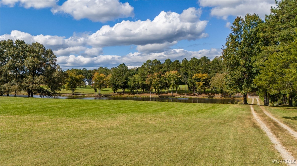 10522 Summer Hill Road Mechanicsville, VA 23116 - Photo 3 of 48 a view of swimming pool and trees in the background