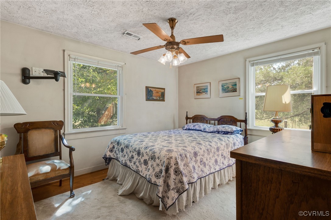 10522 Summer Hill Road Mechanicsville, VA 23116 - Photo 8 of 48 a bedroom with a bed and a window