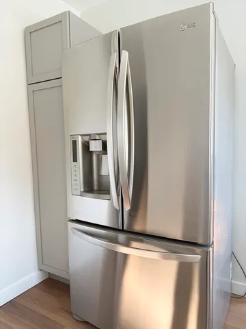 a view of a refrigerator in kitchen