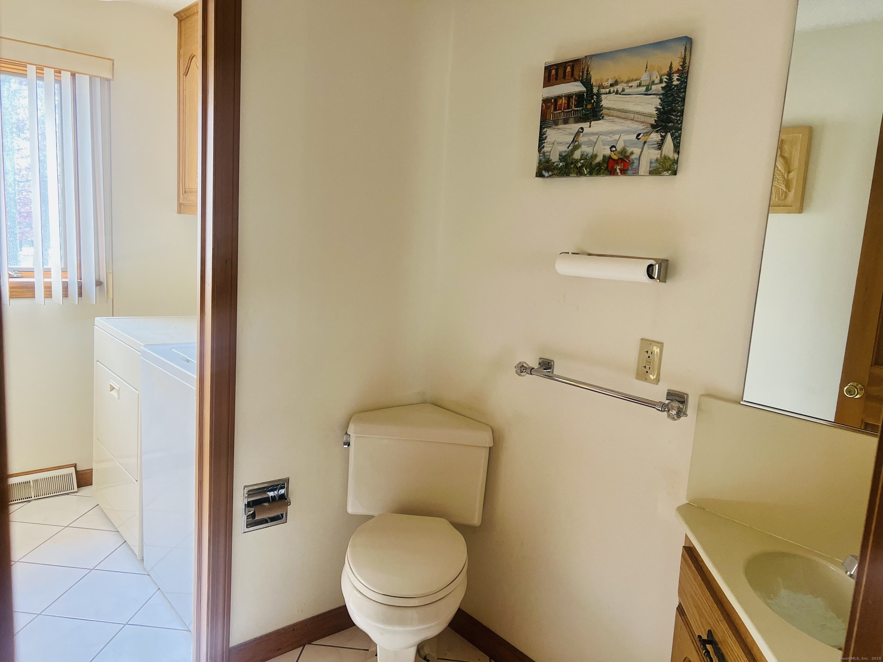 360 Martin Road Hebron, CT 06248 - Photo 17 of 21 a white toilet sitting next to a bathroom sink