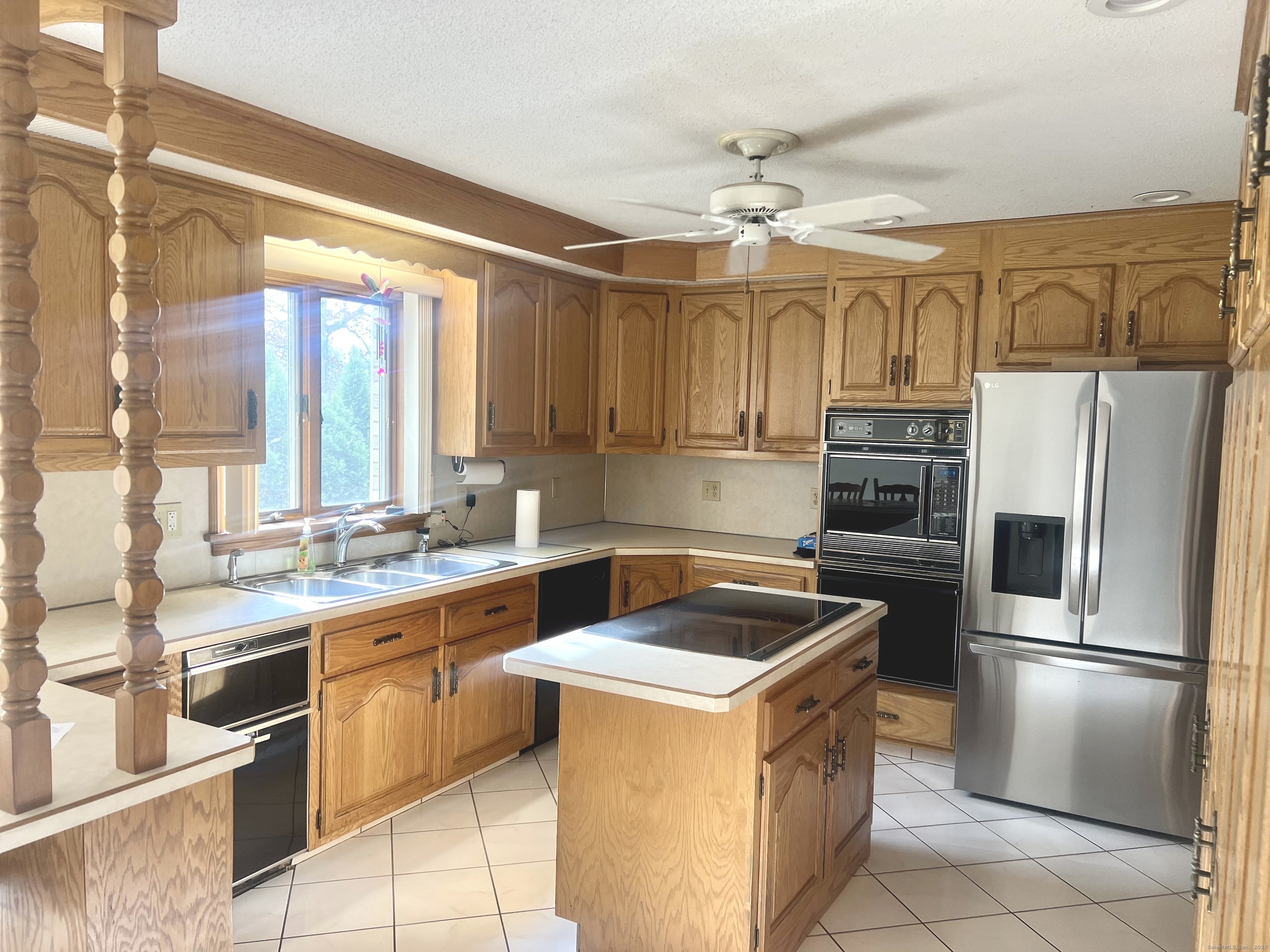 360 Martin Road Hebron, CT 06248 - Photo 7 of 21 a kitchen with a sink appliances and cabinets