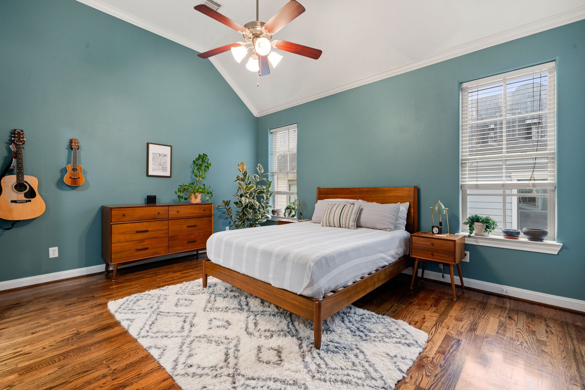 3277 Maxroy Street Houston, TX 77008 - Photo 19 of 27 a bedroom with a bed and wooden floor