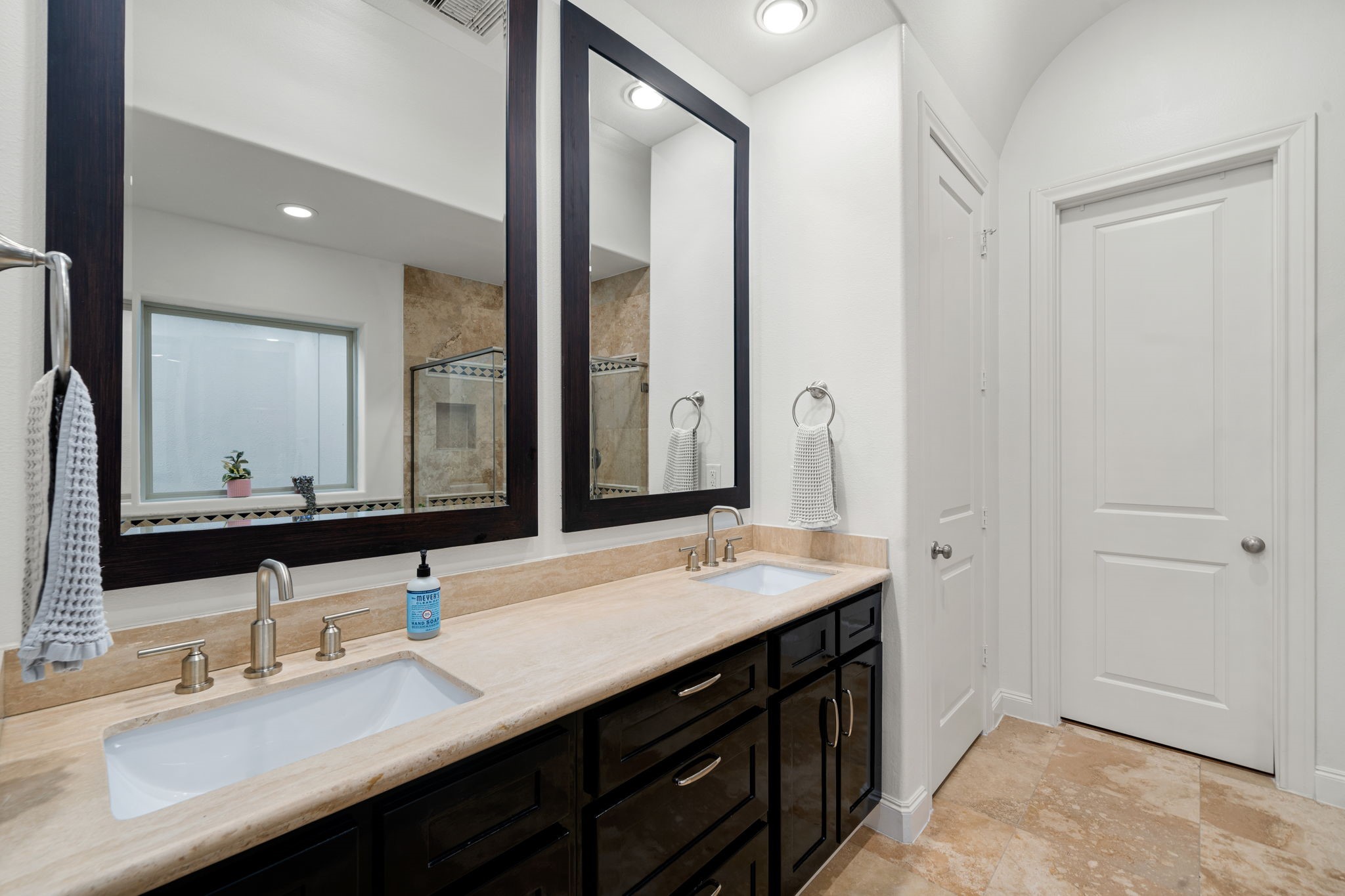 3277 Maxroy Street Houston, TX 77008 - Photo 20 of 27 a bathroom with a double vanity sink and a mirror