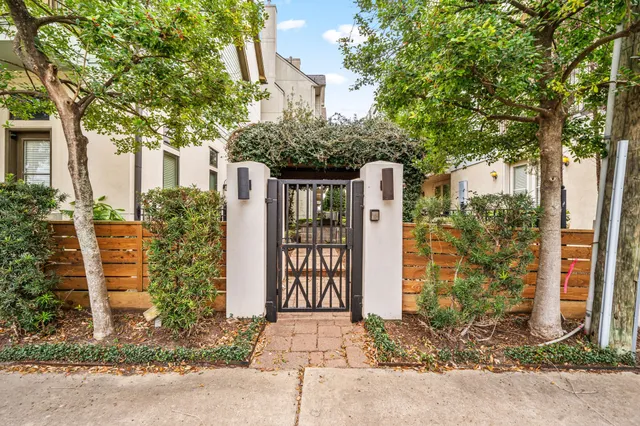 a front view of a house with a plants