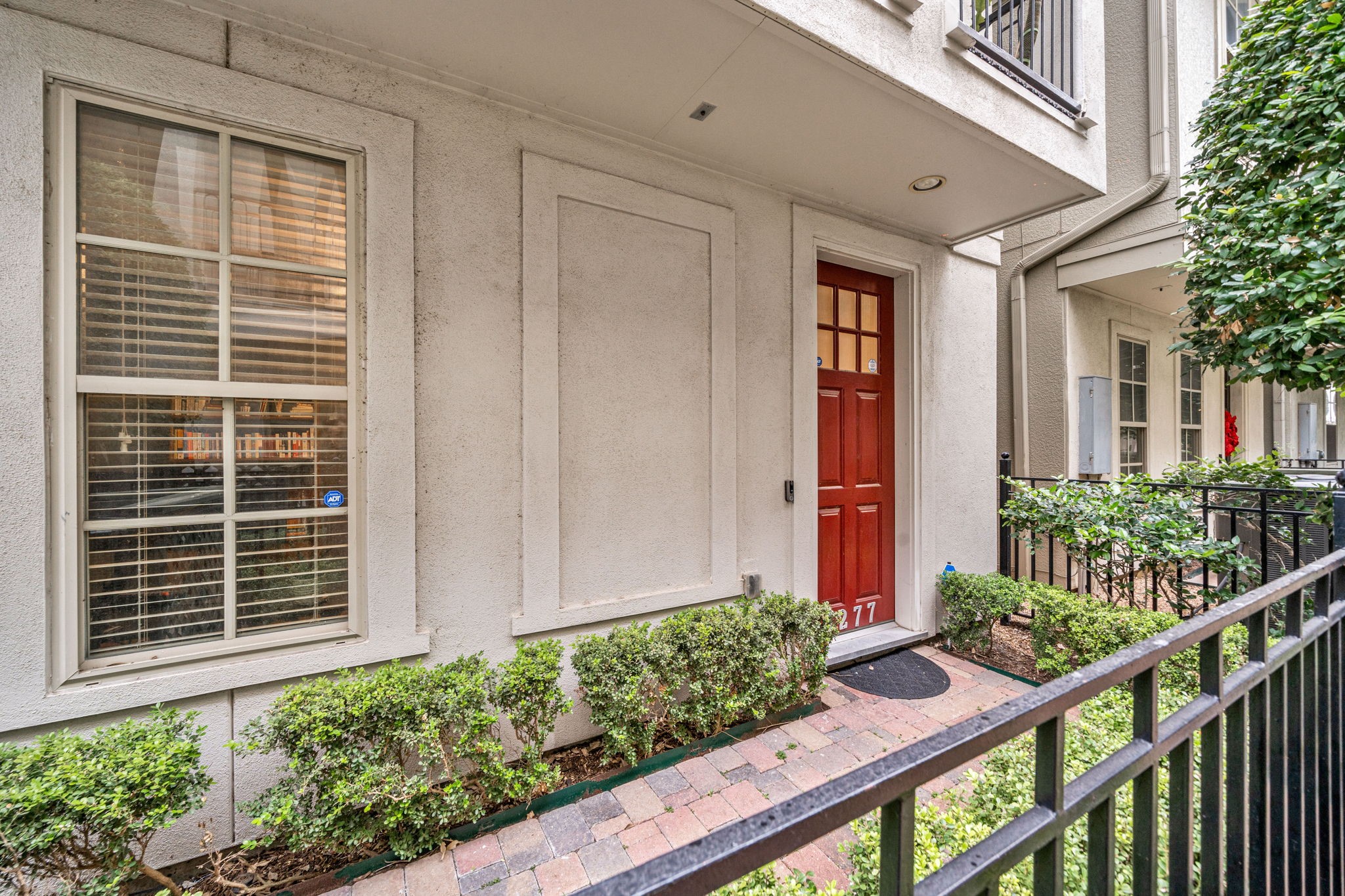 3277 Maxroy Street Houston, TX 77008 - Photo 3 of 27 a view of house with wooden fence and potted plants