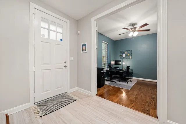 a view of living room with furniture and a chandelier