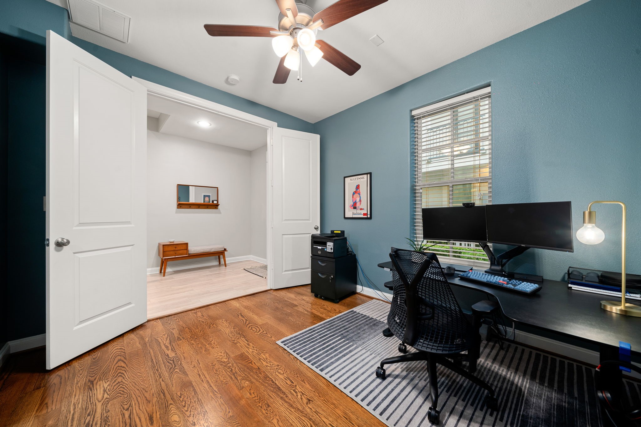 3277 Maxroy Street Houston, TX 77008 - Photo 7 of 27 a view of a workspace with furniture and a window