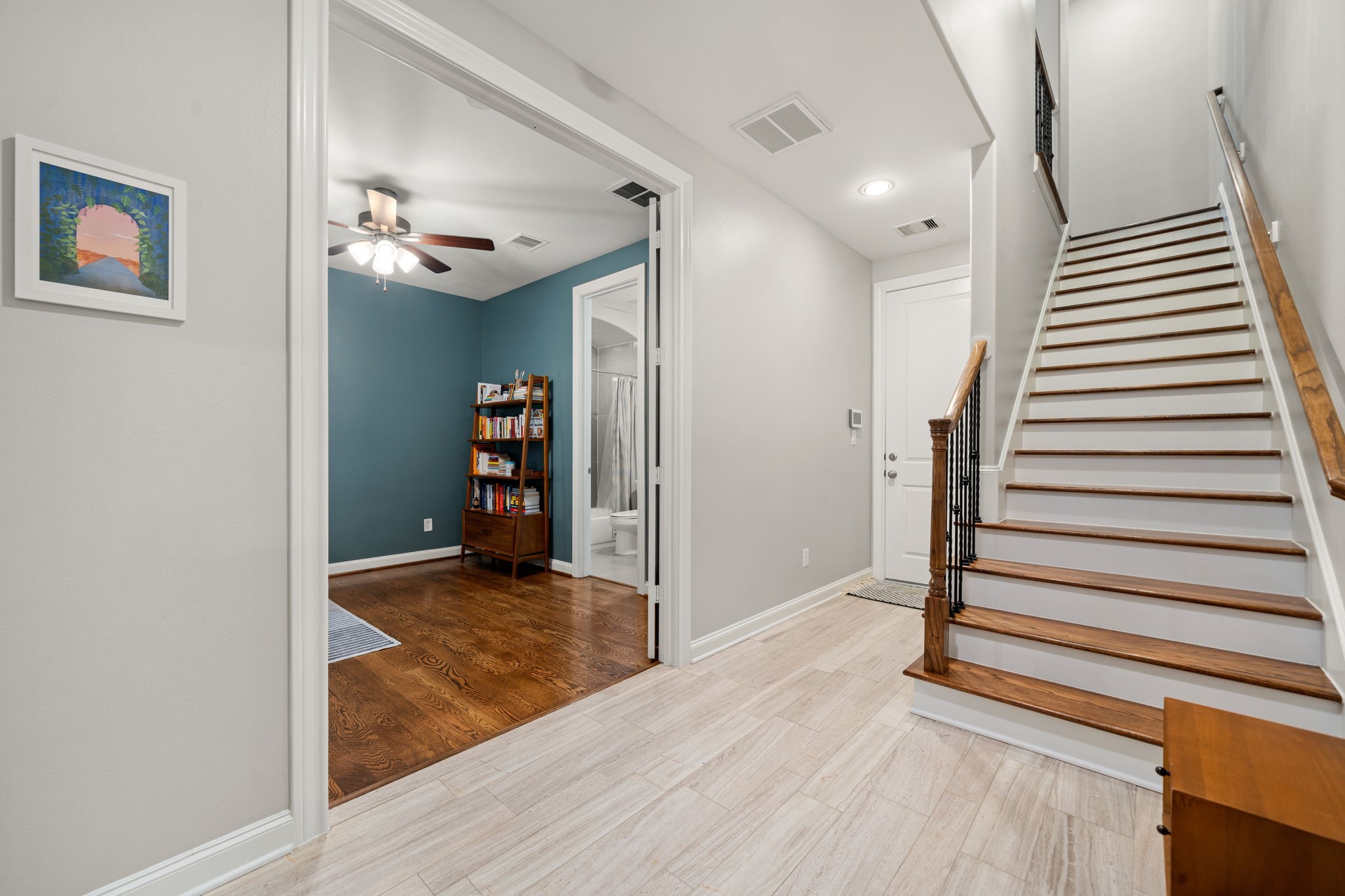 3277 Maxroy Street Houston, TX 77008 - Photo 8 of 27 a view of a livingroom with wooden floor and stairs