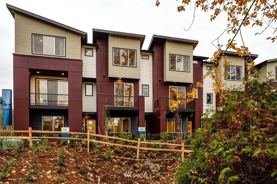 a front view of a brick building with many windows