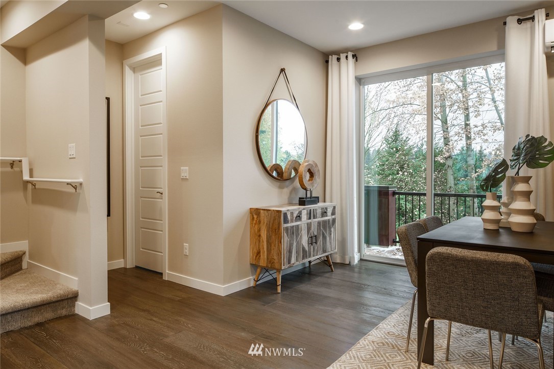 619 238th Street Southeast, Unit B Bothell, WA 98021 - Photo 12 of 20 a living room with furniture a window and wooden floor