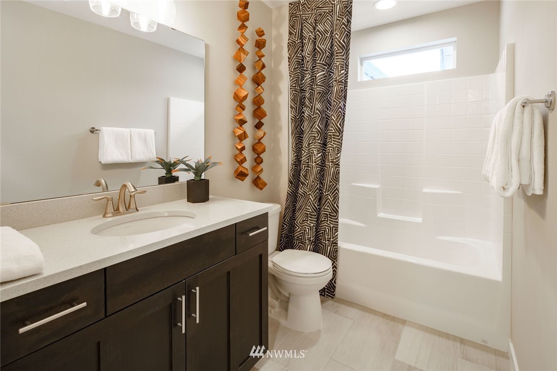 619 238th Street Southeast, Unit B Bothell, WA 98021 - Photo 18 of 20 a bathroom with a sink toilet a mirror and shower