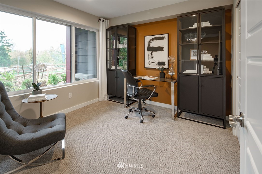 619 238th Street Southeast, Unit B Bothell, WA 98021 - Photo 4 of 20 a work room with furniture and a large window