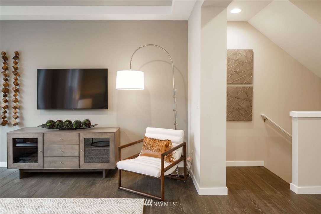 619 238th Street Southeast, Unit B Bothell, WA 98021 - Photo 9 of 20 a living room with furniture and a flat screen tv