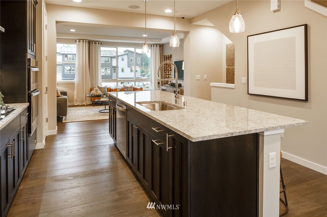 619 238th Street Southeast, Unit B Bothell, WA 98021 - Photo 10 of 20 a kitchen with sink a counter top space and stainless steel appliances