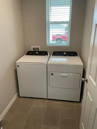 a utility room with dryer and washer