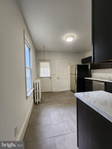 a view of cabinets and wooden floor