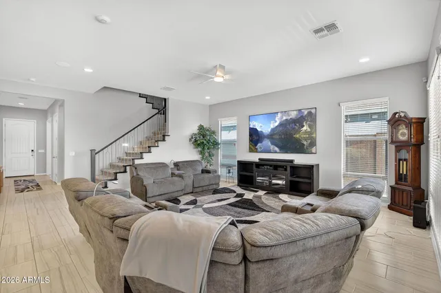a large kitchen with stainless steel appliances and a sink