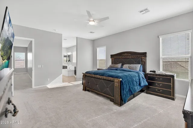 a bathroom with a double vanity sink toilet and a mirror