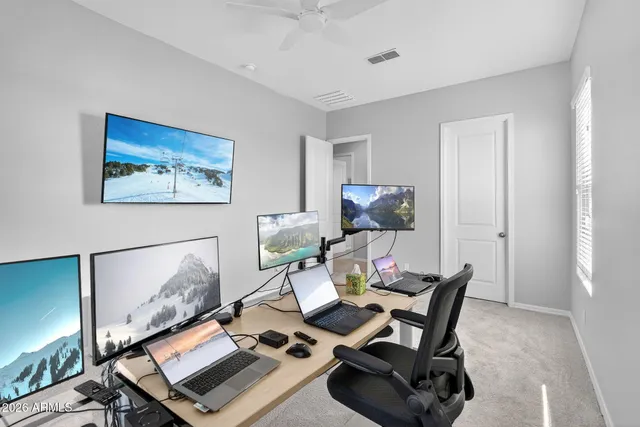 a view of garage with a car parked in it