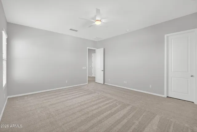 a front view of house with yard seating and patio