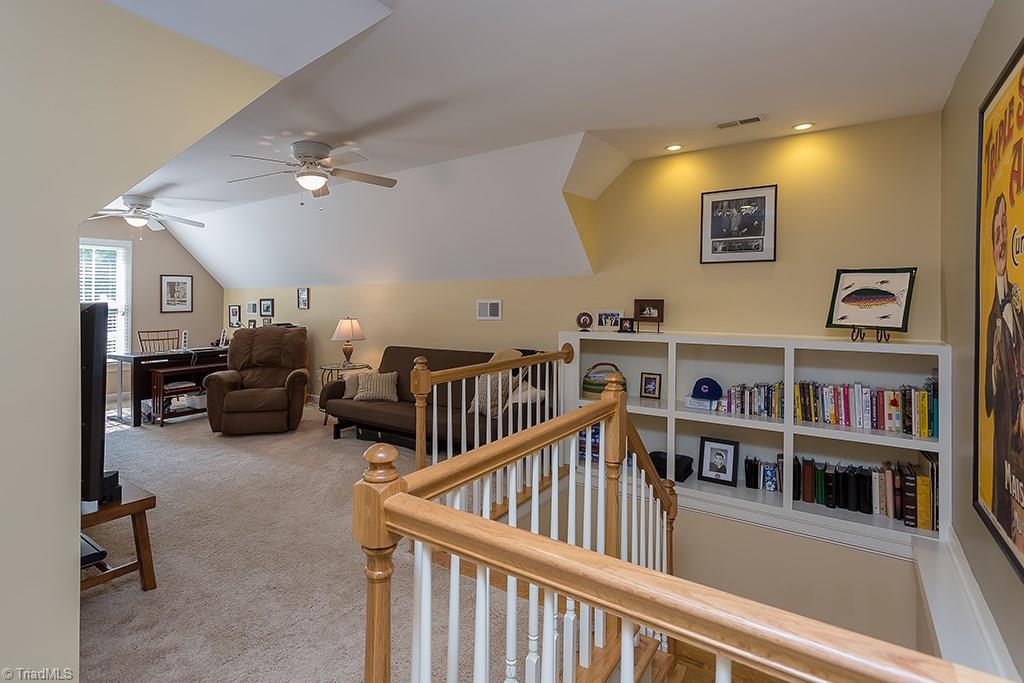 5803 Beckenham Way Oak Ridge, NC 27310 - Photo 20 of 28 The Bonus Room has built in cabinetry and charming entrance to second floor.