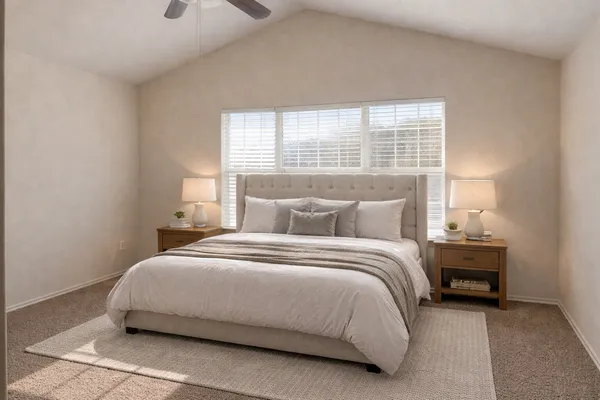 a bedroom with a bed and a night stand