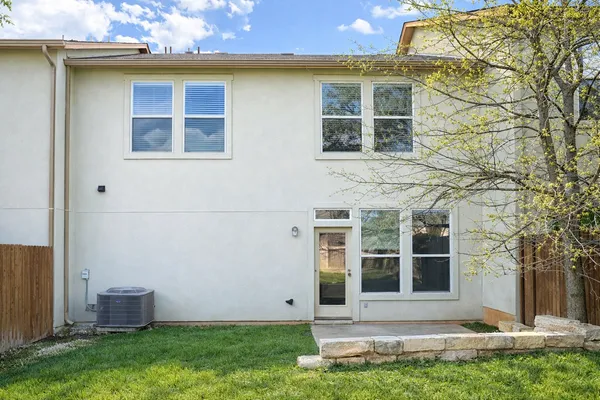 a view of house with yard