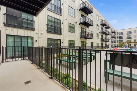a view of a brick building from a balcony