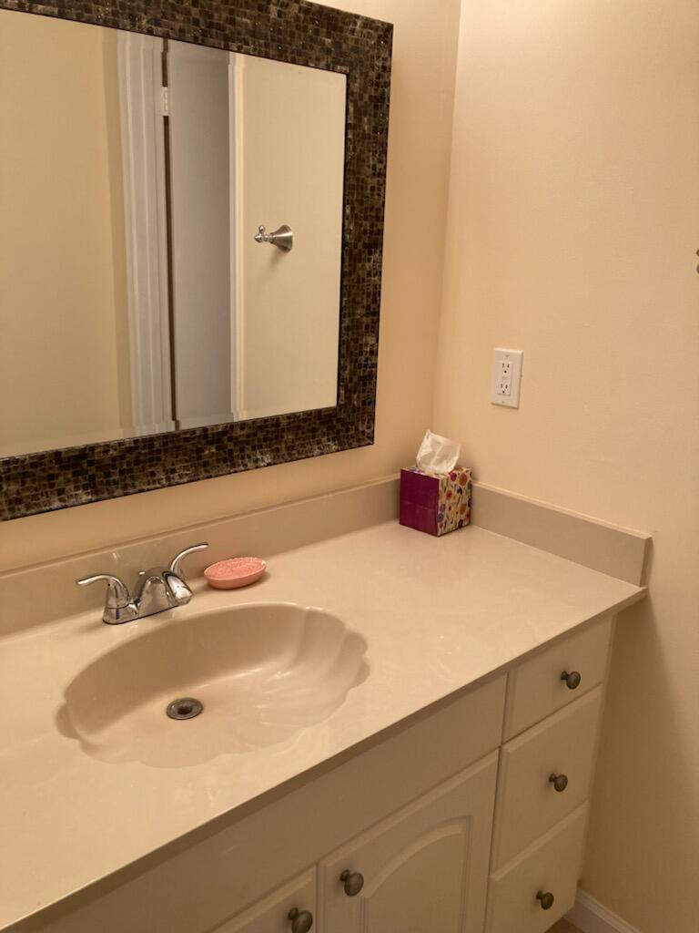 950 South Kanner Highway, Unit C2 Stuart, FL 34994 - Photo 13 of 14 a bathroom with a sink and a mirror