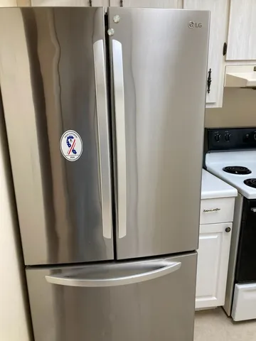 a view of a refrigerator in kitchen